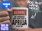 Aprilia Mug - held by man in grey v-neck tee – WARNING Design