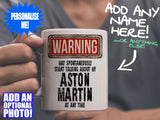 Aston Martin Mug - held by man in grey v-neck tee – WARNING Design
