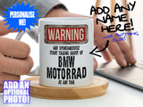 BMW Motorrad Mug – Being held on coaster with man using laptop – WARNING Design