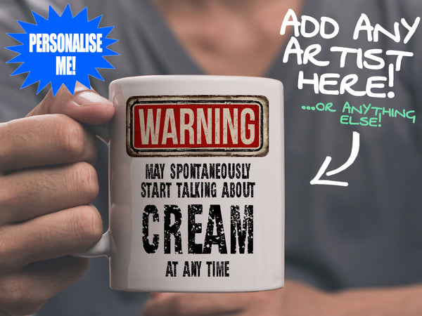 Cream Mug held by man in grey tee shirt – WARNING Design