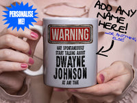 Dwayne Johnson Mug - held by woman in pink blouse