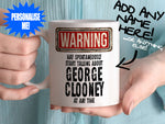 George Clooney Mug - held by woman in turquoise blouse