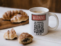 George Clooney Mug with coffee and pastries – WARNING Design