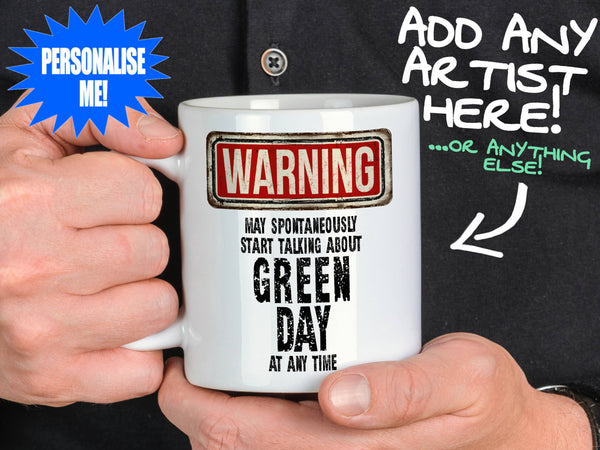 Green Day Mug held by man in black shirt – WARNING Design