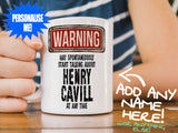 Henry Cavill Mug – on wooden table with striped t-shirt