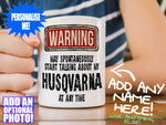 Husqvarna Mug – on wooden table with striped t-shirt