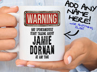 Jamie Dornan Mug – held by woman in striped shirt