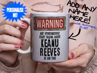 Keanu Reeves Mug - held by woman in pink blouse
