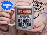 Leonardo DiCaprio Mug - held by woman in pink blouse