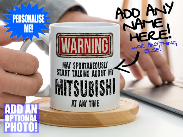 Mitsubishi Mug – Being held on coaster with man using laptop – WARNING Design