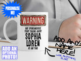 Sophia Loren Mug – on desk with man writing on clipboard – WARNING Design