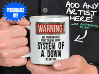 System of a Down Mug held by man in black shirt – WARNING Design