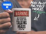 Talking Heads Mug held by man in grey tee shirt – WARNING Design