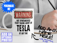 Tesla Mug – on desk with man writing on clipboard – WARNING Design