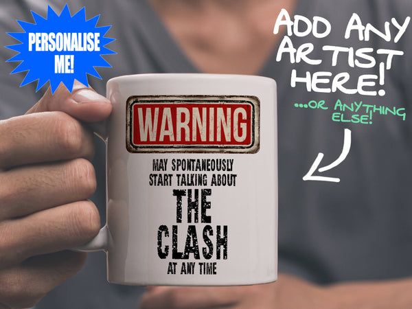The Clash Mug held by man in grey tee shirt – WARNING Design