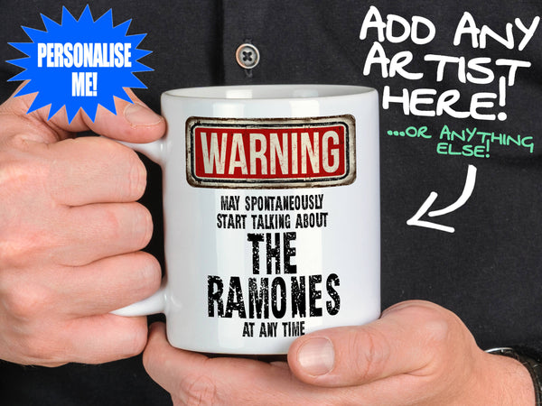 The Ramones Mug held by man in black shirt – WARNING Design