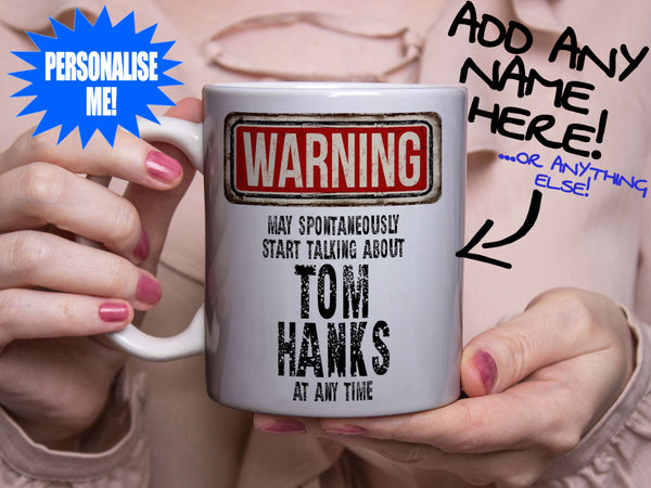 Tom Hanks Mug - held by woman in pink blouse