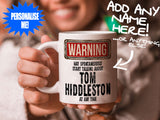 Tom Hiddleston Mug held by smiling woman – WARNING Design
