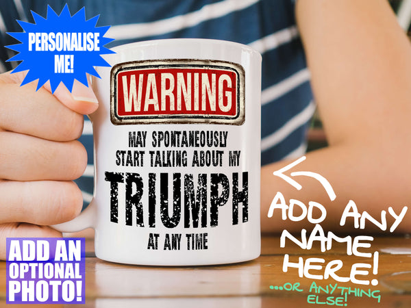 Triumph Mug – on wooden table with striped t-shirt