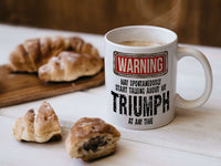 Triumph Mug with coffee and croissants – WARNING Design
