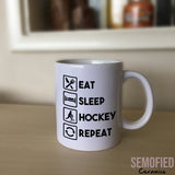 Eat Sleep Hockey Repeat Mug on Sideboard