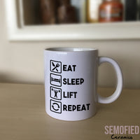 Eat Sleep Lift Repeat Mug on Sideboard