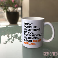 Thinking About Robbie Williams - Mug on Glass Table